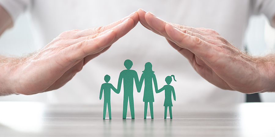 hands protecting a family